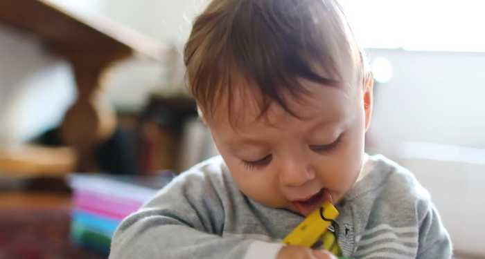 Baby chewing on teething toy
