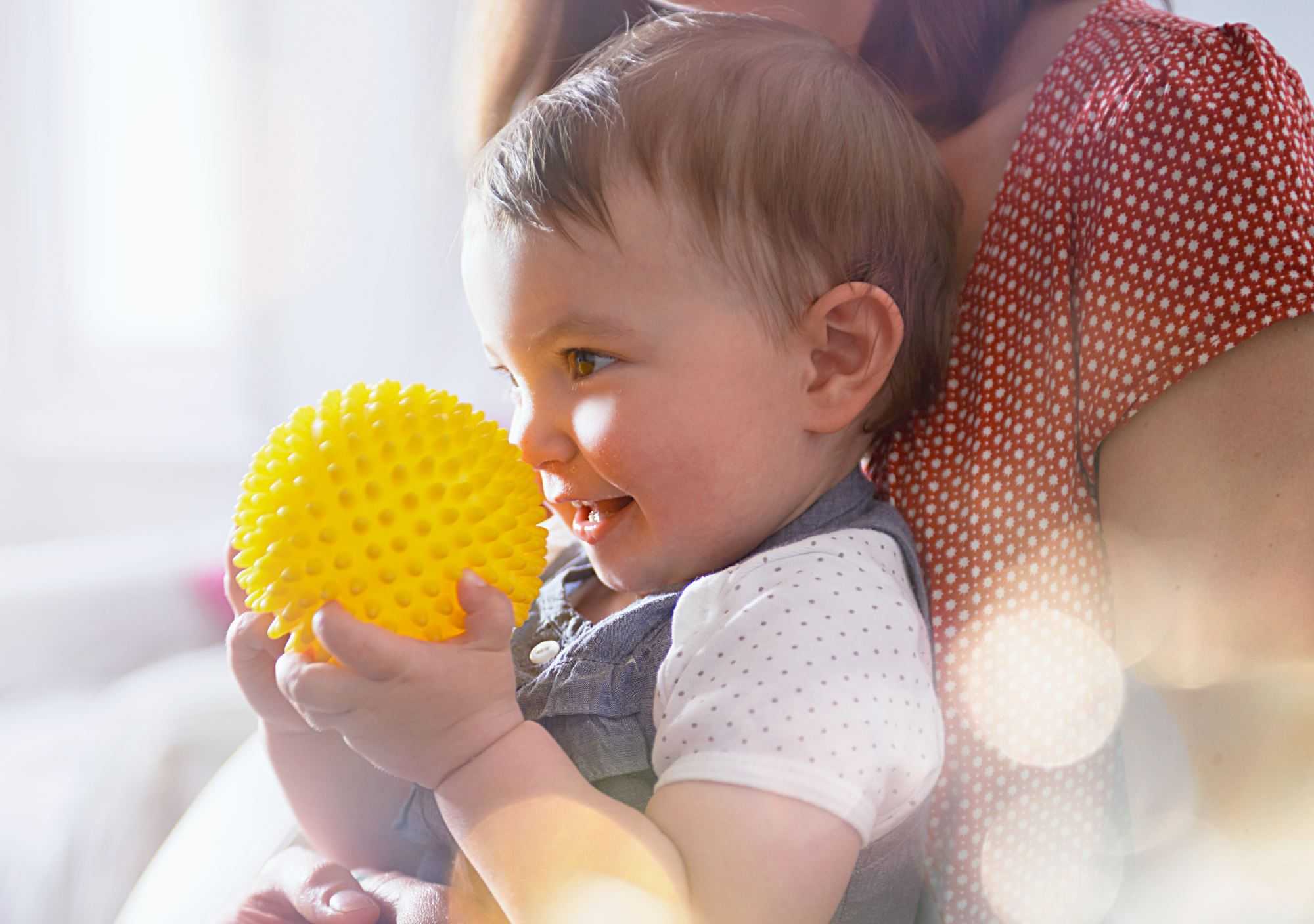 Child with a yellow ball