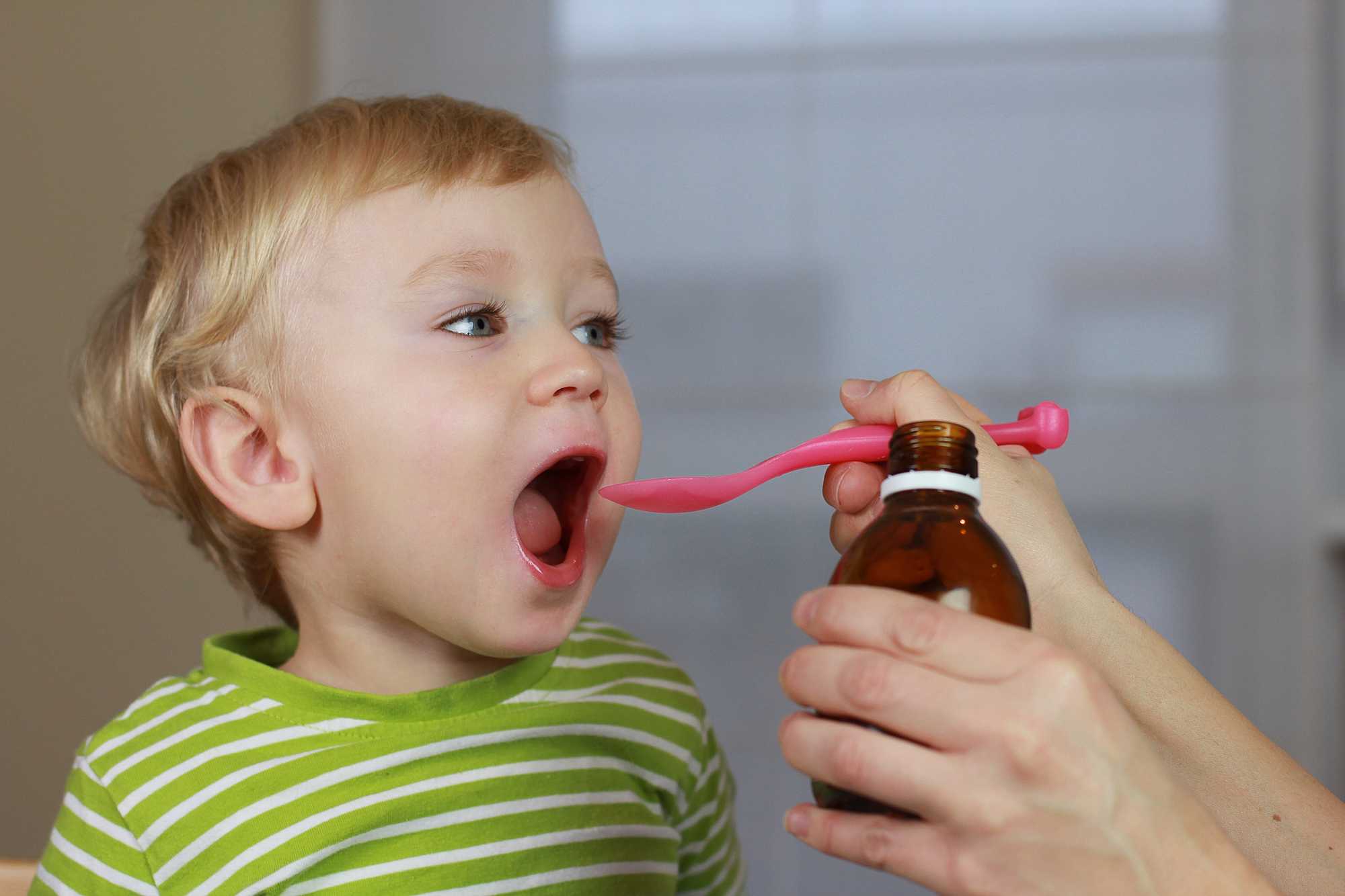 Child taking medicine